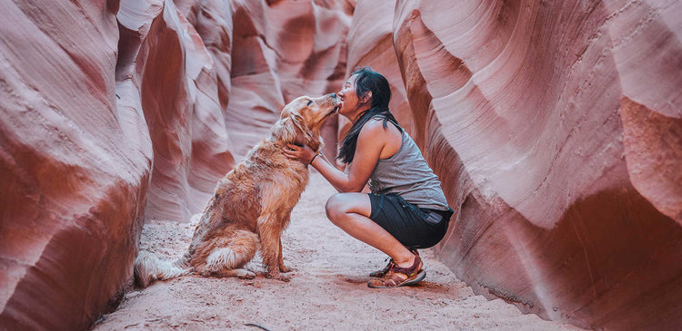 A woman taking her dog to Antelope Canyon