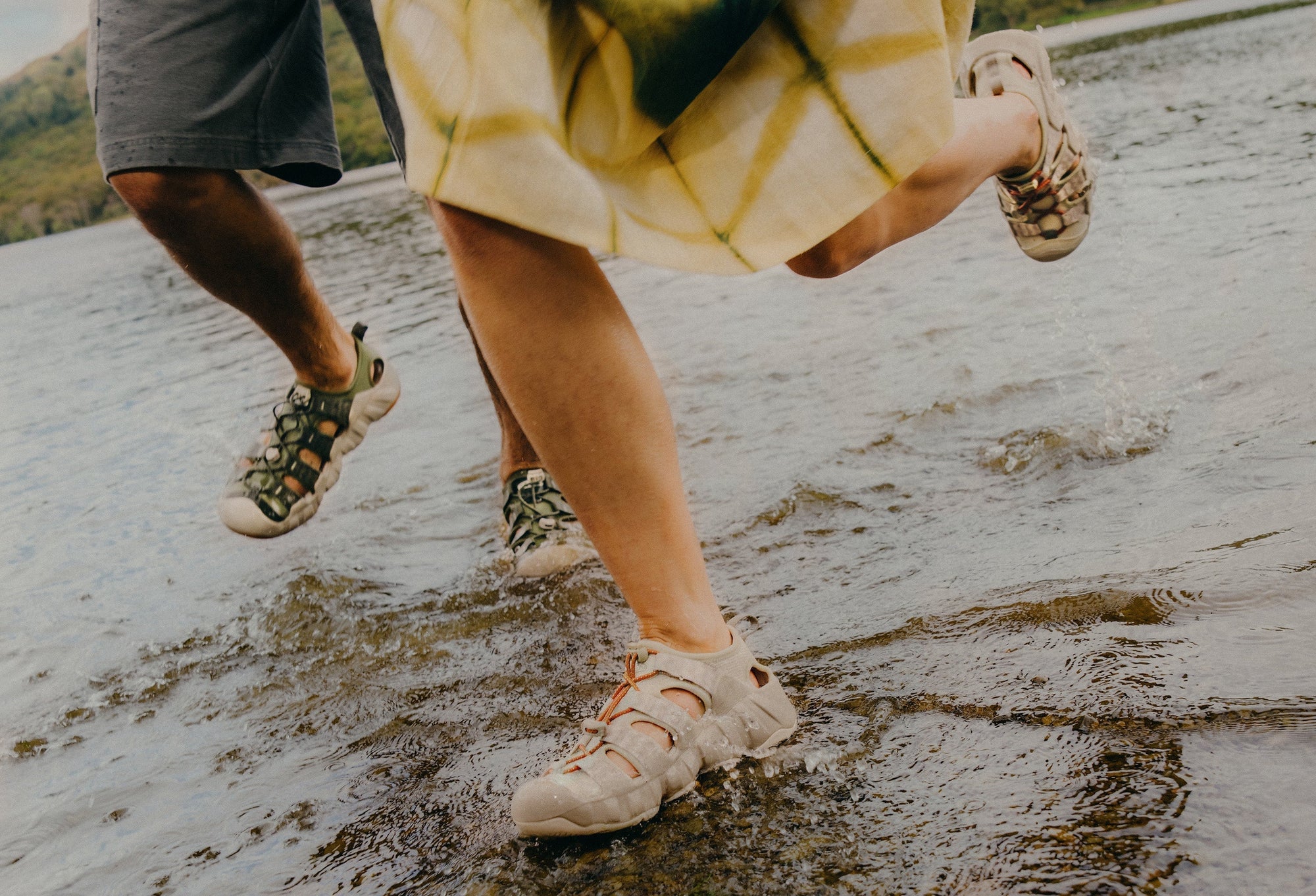 two people running through water