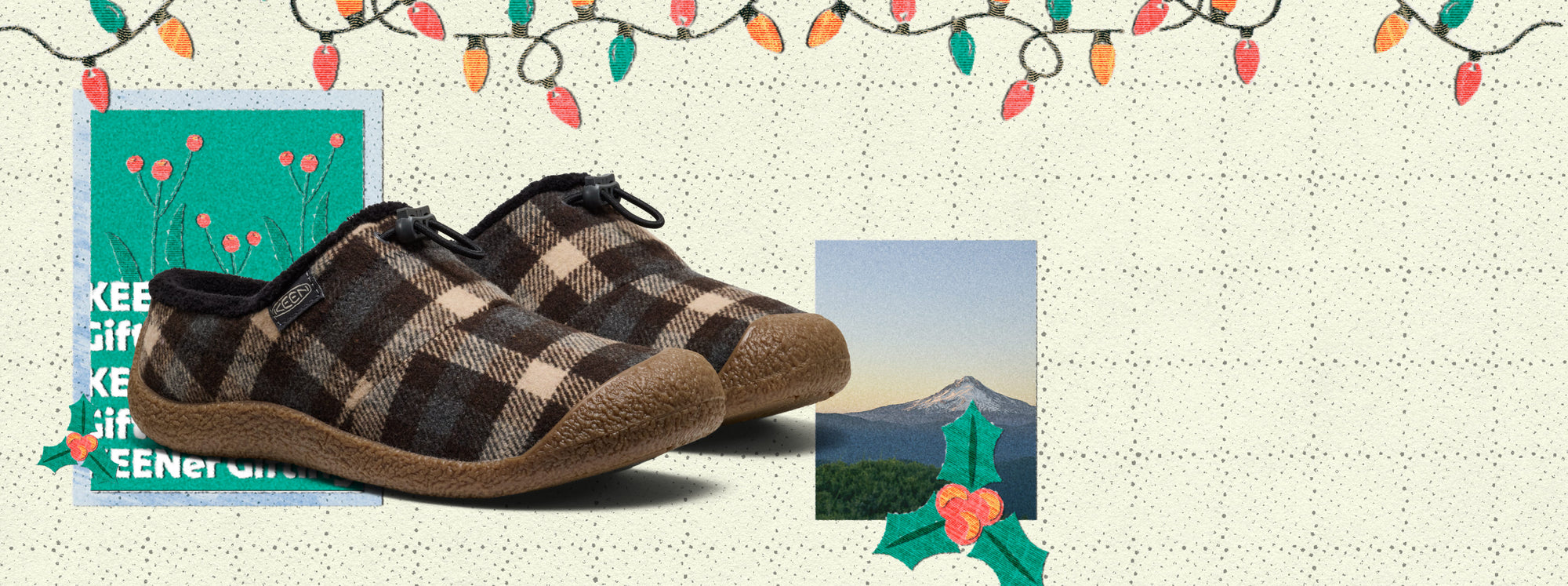 A pair of paid slippers positioned in front of a Christmas tree, which is adorned with lights, ornaments and scraps of wrapping paper.