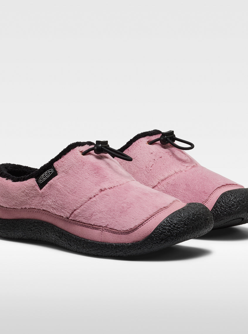 Studio product shot of fuzzy pink Howser slip-on shoes with black bungee tightening system.