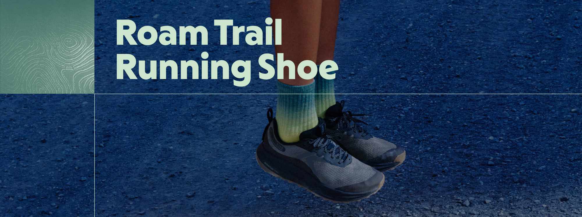  A person wearing running shoes labeled "roam trail running shoe," showcasing their design and functionality for outdoor running.