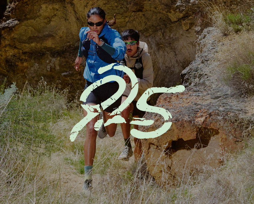 A pair of runners on a trail, embedded with a "925 graphic", capturing a moment of athleticism and movement.