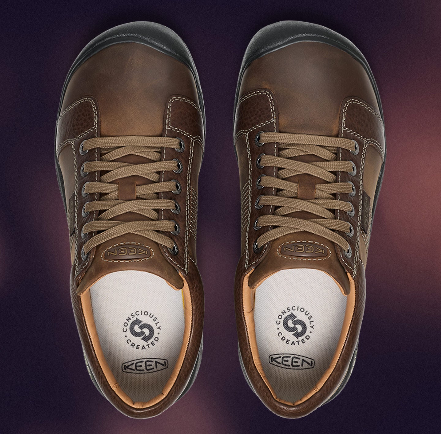 A pair of brown leather sneakers with a wide fit