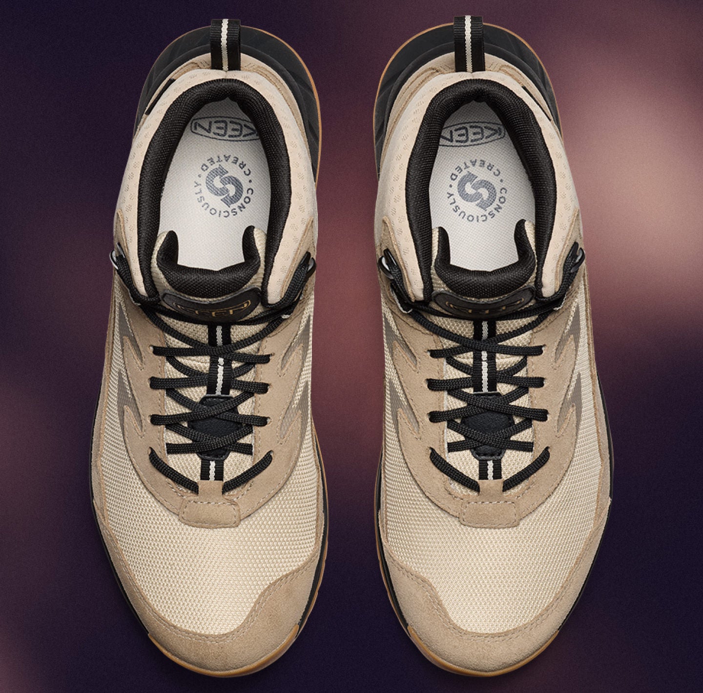 A pair of tan hiking shoes with a wide fit