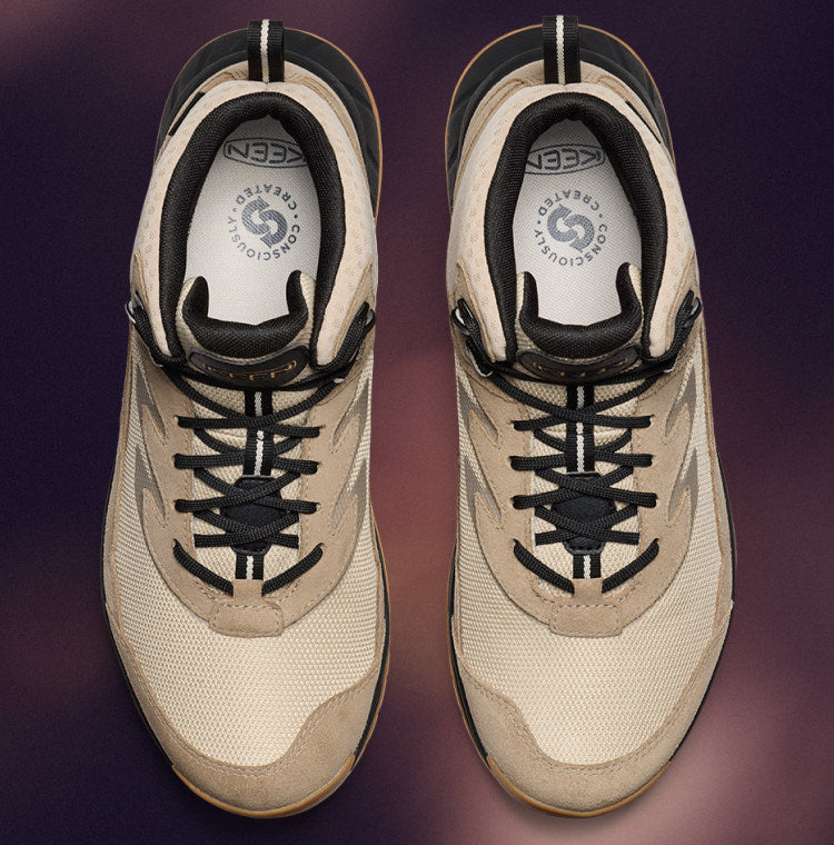 A pair of tan hiking shoes with a wide fit