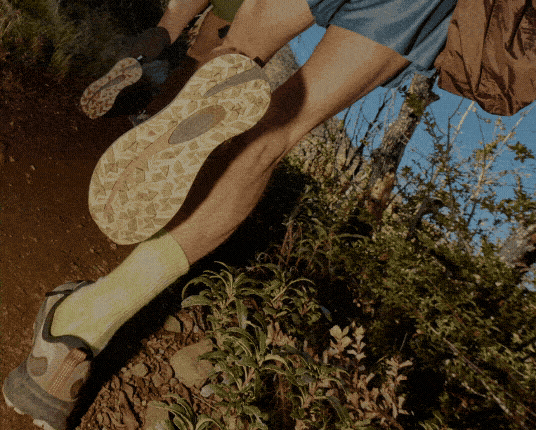 Connected Ride logo embedded over blurred image of two trail runners.