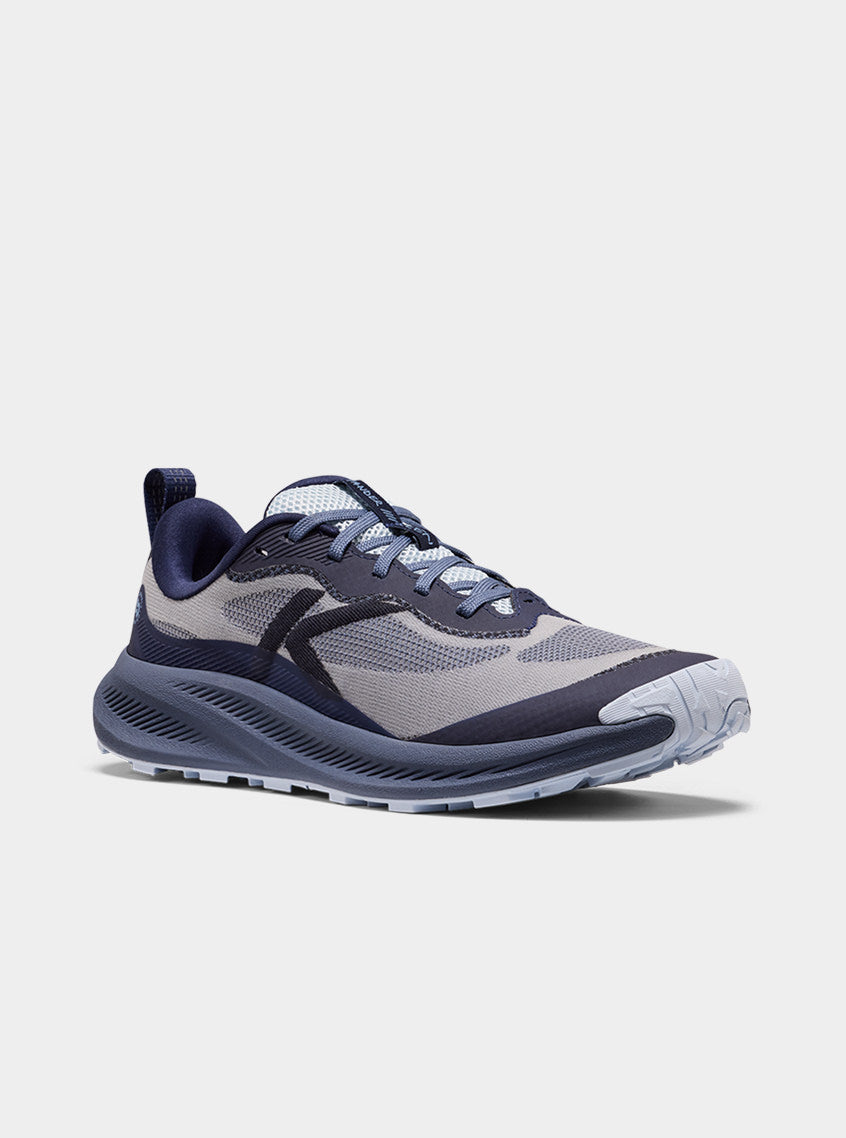 Product shot of women's indigo and skyway blue Wander trail-running shoe.