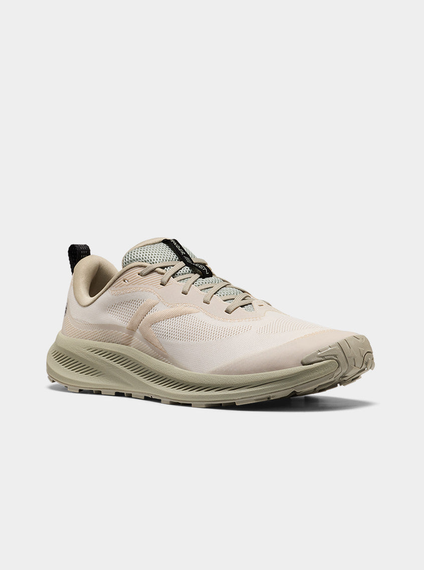 Product shot of men's starwhite and desert sage Wander trail-running shoe.